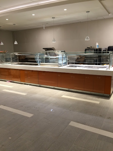 A large kitchen with a counter and a lot of counter space